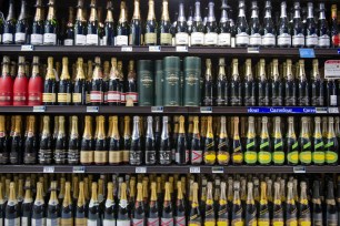 Shelf of Champagne bottles in a supermarket near Paris, indicating a decrease in sales