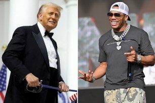 President Donald Trump cuts a cake with a sword during the Commander in Chief Ball in honor of his inauguration in Washington, U.S., January 20, 2025.