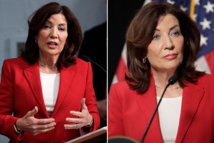 Kathy Hochul, a woman in a red suit