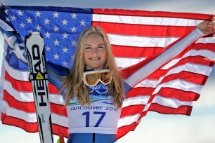 Lindsey Vonn, bronze medalist, holding the Stars and Stripes during the Women's super-G at the Vancouver 2010 Olympics