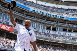 Yankees CC Sabathia salutes fans as he walks out to the field for introductions during Old Timerâs Day before a game against the Colorado Rockies, Saturday, Aug. 24, 2024, in Bronx, NY