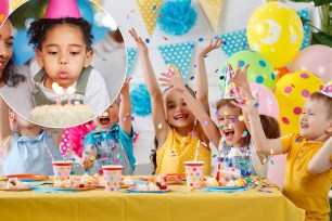 Group of happy children celebrating a birthday with cake and balloons, with celebrity Henry Simmons present