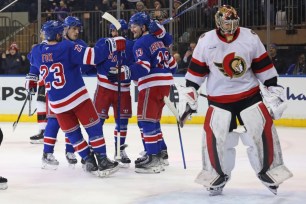 The Rangers celebrate Alexis Lafreniere's goal in the first period of their 5-0 win over the Senators on Jan. 21, 2025.