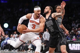 Josh Hart, who scored seven points, to go along with 12 rebounds and nine assists, drives on Tyrese Martin during the Knicks' 99-95 win over the Nets on Jan. 21, 2025.