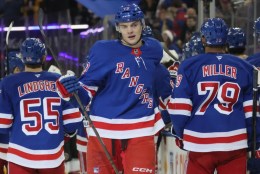 Matt Rempe (center) celebrates with teammates after scoring a third-period goal in the Rangers' 5-0 blowout win over the Senators on Jan. 21, 2025.