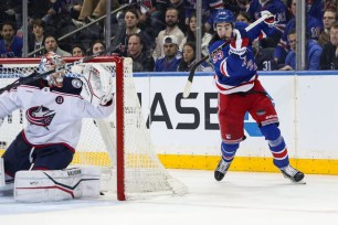 Mika Zibanejad attempts a wraparound shot on Daniil Tarasov during the Rangers' 1-0 shootout win over the Blue Jackets on Jan. 18, 2025.