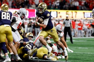 Riley Leonard rushes for a touchdown during Notre Dame's College Football Playoff championship game against Ohio State on Jan. 20.