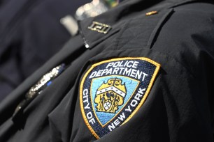 11/19/21: A NYC police officer's patch seen in Times Square. 