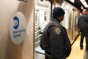 Police officers investigating at a NYC subway station following a stabbing incident on the evening of October 19, 2022.