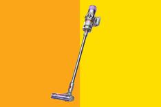 Vacuum cleaner against a yellow background