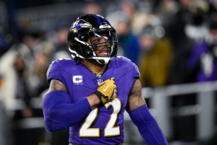 Derrick Henry reacts after scoring a touchdown during the Ravens' AFC wild-card win over the Steelers.