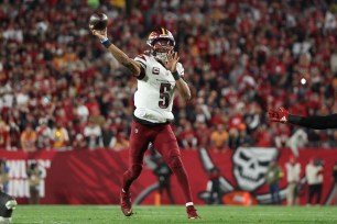 Jayden Daniels throws a pass during the Commanders-Buccaneers game on Jan. 12, 2025.