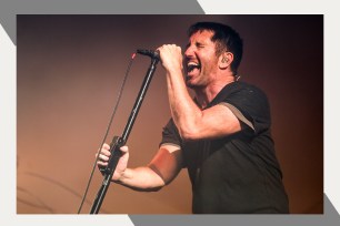 Nine Inch Nails singer Trent Reznor digs deep into his soul and lets out a primal yell onstage.