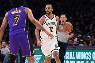 Tosan Evbuomwan #12 of the Brooklyn Nets dribbles the ball during the game against the Los Angeles Lakers on January 17, 2025 at Crypto.Com Arena in Los Angeles, California. 